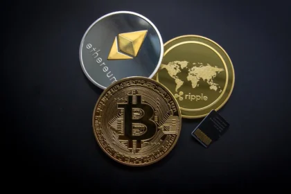 Various cryptocurrency coins and a chip